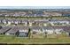 Aerial view of neighborhood with pool and lake at 5307 Grove Mill Loop, Lakewood Ranch, FL 34211