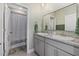 Modern bathroom with double sinks and a shower/tub combo at 5307 Grove Mill Loop, Lakewood Ranch, FL 34211