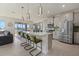 Contemporary kitchen featuring granite countertops and island at 5307 Grove Mill Loop, Lakewood Ranch, FL 34211