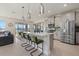 Modern kitchen with stainless steel appliances and an island at 5307 Grove Mill Loop, Lakewood Ranch, FL 34211