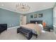 Main bedroom featuring a king-size bed and large windows at 5307 Grove Mill Loop, Lakewood Ranch, FL 34211