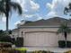 Home features a double garage and light pink exterior at 5449 Chanteclaire # 75, Sarasota, FL 34235