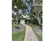 Brick pathway leads to a community pool area at 5449 Chanteclaire # 75, Sarasota, FL 34235