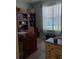 Home office with built-in shelving and a desk at 5452 Club View Ln, North Port, FL 34287