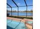 Private screened pool with spa and lake view at 5452 Club View Ln, North Port, FL 34287