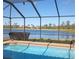 Relaxing screened pool with lake view at 5452 Club View Ln, North Port, FL 34287