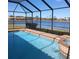 Screened pool and spa overlooking lake at 5452 Club View Ln, North Port, FL 34287