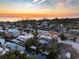 Aerial view of waterfront homes at sunset at 550 De Narvaez Dr, Longboat Key, FL 34228