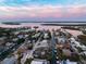 Aerial view showcasing waterfront home and neighborhood at 550 De Narvaez Dr, Longboat Key, FL 34228