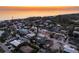 Aerial view of waterfront homes at sunset at 550 De Narvaez Dr, Longboat Key, FL 34228