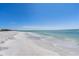 Expansive white sand beach with gentle waves at 550 De Narvaez Dr, Longboat Key, FL 34228