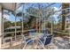 This screened patio offers a tranquil setting with water views at 550 De Narvaez Dr, Longboat Key, FL 34228