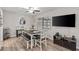 Dining room boasts modern ceiling fan, wood-look flooring, and neutral wall paint at 5616 Mashie Cir, North Port, FL 34287