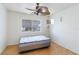 Simple bedroom with ceiling fan and wood floor at 5907 Todd St # E36, Bradenton, FL 34207