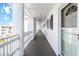 Clean and bright hallway with white walls and white railings at 5907 Todd St # E36, Bradenton, FL 34207