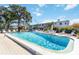 Community pool with plenty of lounge chairs at 5907 Todd St # E36, Bradenton, FL 34207