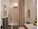 Stylish bathroom with a bathtub, shower, and light color palette at 6039 Salt Grass St, Bradenton, FL 34210