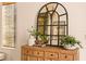 Light and airy entryway with a statement mirror and wooden console at 6039 Salt Grass St, Bradenton, FL 34210