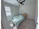 Small bedroom with twin beds and window at 649 Maraviya Blvd, Nokomis, FL 34275