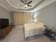 Bright bedroom featuring a large window and ceiling fan at 649 Maraviya Blvd, Nokomis, FL 34275