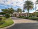 Community entrance with palm trees and landscaping at 649 Maraviya Blvd, Nokomis, FL 34275