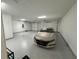 Spacious two-car garage with epoxy flooring at 649 Maraviya Blvd, Nokomis, FL 34275