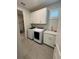 Laundry room with washer, dryer, and cabinets at 649 Maraviya Blvd, Nokomis, FL 34275