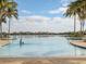 Community pool with lake view; perfect for relaxation at 649 Maraviya Blvd, Nokomis, FL 34275