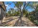 Large backyard with fire pit and mature trees at 6507 36Th Avenue W Dr, Bradenton, FL 34209