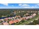 Aerial view of neighborhood with houses and lake at 6841 74Th Street E Cir, Bradenton, FL 34203