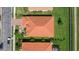 Aerial view of single-Gathering home with orange tile roof in a residential neighborhood at 6841 74Th Street E Cir, Bradenton, FL 34203