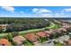 Aerial view of neighborhood with houses and lake at 6841 74Th Street E Cir, Bradenton, FL 34203