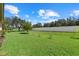 Large backyard with grassy area and privacy fence at 6841 74Th Street E Cir, Bradenton, FL 34203