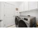 Laundry room with washer and dryer, and cabinets at 6841 74Th Street E Cir, Bradenton, FL 34203