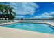 Inviting community pool overlooking a tranquil lake at 6920 74Th Street E Cir, Bradenton, FL 34203