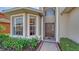 Front entrance with a bay window and a dark brown door at 6920 74Th Street E Cir, Bradenton, FL 34203