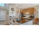 Modern kitchen with granite countertops and wood cabinets at 6920 74Th Street E Cir, Bradenton, FL 34203