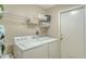 Laundry room with washer, dryer, and shelving at 6920 74Th Street E Cir, Bradenton, FL 34203