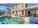 Screened pool and patio with lake view at 6920 74Th Street E Cir, Bradenton, FL 34203