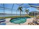 Inviting kidney-shaped pool with screened enclosure at 6920 74Th Street E Cir, Bradenton, FL 34203