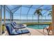 Relaxing screened pool and spa with lake view at 6920 74Th Street E Cir, Bradenton, FL 34203