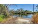 Serene waterfront view with sandy shore at 6920 74Th Street E Cir, Bradenton, FL 34203