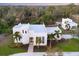 An aerial shot of a stunning modern home on a large lot at dusk at 6939 Bee Ridge Rd, Sarasota, FL 34241