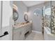 Contemporary bathroom with double sinks and a walk-in shower at 6939 Bee Ridge Rd, Sarasota, FL 34241