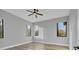 Simple bedroom with light gray walls and hardwood floors at 6939 Bee Ridge Rd, Sarasota, FL 34241