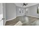 Well-lit bedroom featuring hardwood floors and a ceiling fan at 6939 Bee Ridge Rd, Sarasota, FL 34241