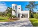 Modern home with circular tower and attached garage at 6939 Bee Ridge Rd, Sarasota, FL 34241