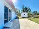 Spacious backyard with a storage shed and patio perfect for outdoor living and entertaining at 712 N Elm St, Englewood, FL 34223