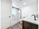 Stylish bathroom showcasing a walk-in shower, dual-sink vanity, and modern finishes at 712 N Elm St, Englewood, FL 34223