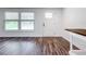 Modern living room featuring stylish flooring and an abundance of natural light from a large window at 712 N Elm St, Englewood, FL 34223